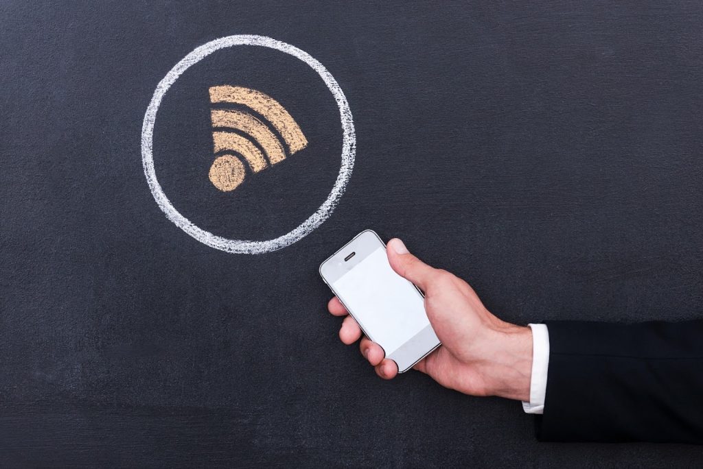 Man connecting wifi with phone
